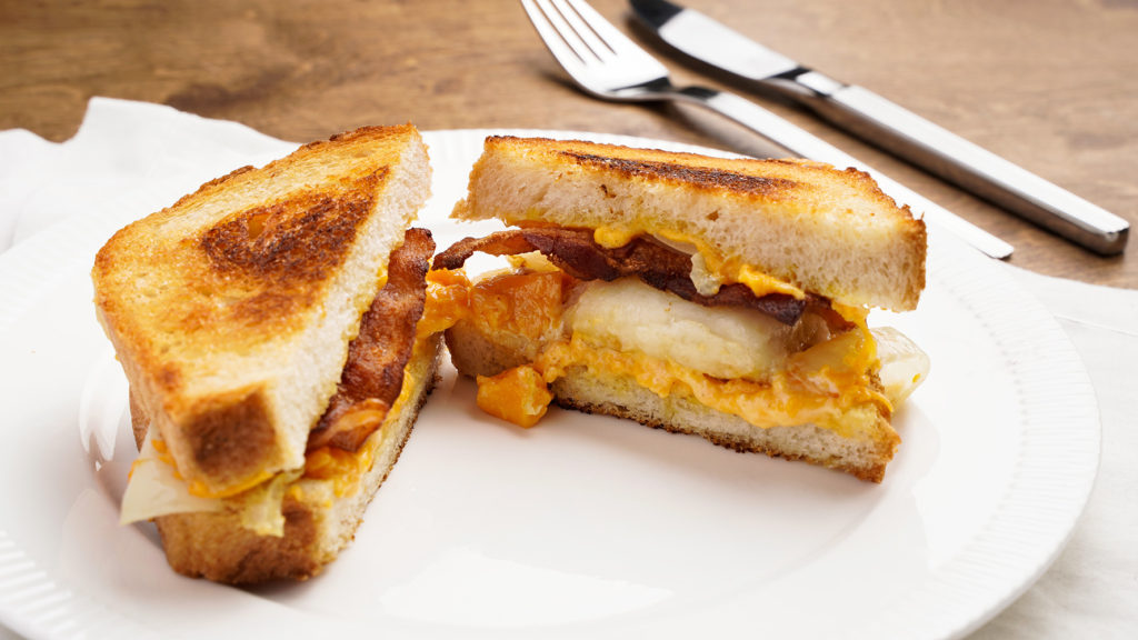 Hungry Rooster Slap down grill cheese sandwich with perogies and bacon